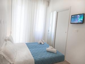 Postel nebo postele na pokoji v ubytování Riviera Mare Beach Life Hotel