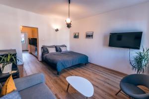 Posteľ alebo postele v izbe v ubytovaní Apartmány CAFÉ-CAFÉ