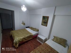 Postel nebo postele na pokoji v ubytování Üsküdar halk caddesi