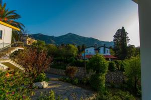 a view of a house with mountains in the background at Metin Houses in Kyrenia