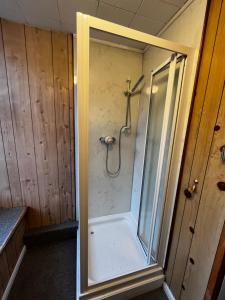 a shower with a glass door in a bathroom at Dunarle Guesthouse in Oban +82 photos