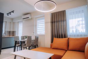 a living room with a couch and a table at Bellissimo Apartments in Ohrid