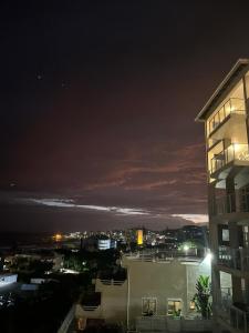 a view of a city at night with a building at 201 St Tropez, South Coast in Margate