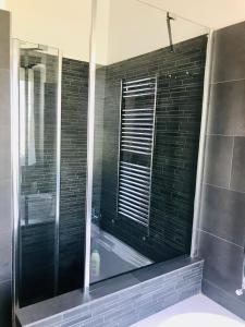 a bathroom with a bath tub and a window at Carolina’S Nest in Casal Palocco