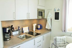 A cozinha ou kitchenette de Ferienwohnung Witt Hingst