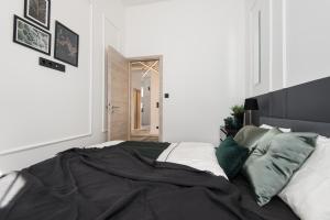 Posteľ alebo postele v izbe v ubytovaní Holló 3 Bedroom Downtown Apartment