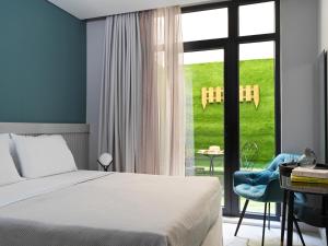 Ein Bett oder Betten in einem Zimmer der Unterkunft Athens City View Urban Suites