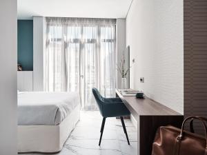 Ein Bett oder Betten in einem Zimmer der Unterkunft Athens City View Urban Suites