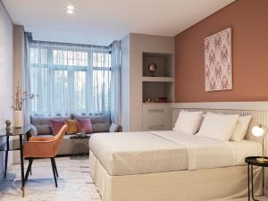 Ein Bett oder Betten in einem Zimmer der Unterkunft Athens City View Urban Suites