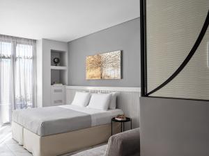 Posteľ alebo postele v izbe v ubytovaní Athens City View Urban Suites