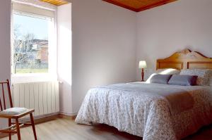 Casa Galegos tesisinde bir odada yatak veya yataklar