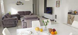 a living room with a table with fruit on it at Villa la Perla in Baška Voda