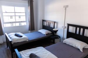 Postel nebo postele na pokoji v ubytování Urbany Hostel London 18-40 Years Old