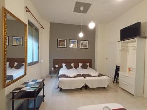 Ένα ή περισσότερα κρεβάτια σε δωμάτιο στο CH Murallas II