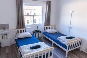 Postel nebo postele na pokoji v ubytování Urbany Hostel London 18-40 Years Old