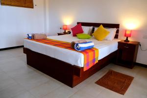 Wellé Wadiya Beach Villa客房内的一张或多张床位