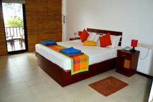 Wellé Wadiya Beach Villa客房内的一张或多张床位