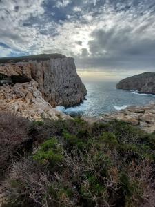 a view of the ocean from a cliff at Arcamyrtus in Alghero