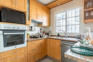 A kitchen or kitchenette at Eco Playa Suites - Beach & Golf!