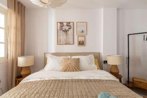 A bed or beds in a room at Eco Playa Suites - Beach & Golf!