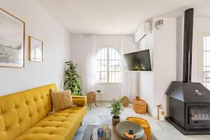 A television and/or entertainment centre at Eco Playa Suites - Beach & Golf!