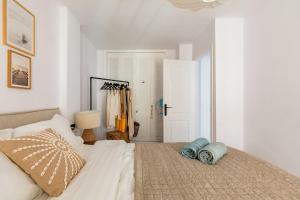 A bed or beds in a room at Eco Playa Suites - Beach & Golf!