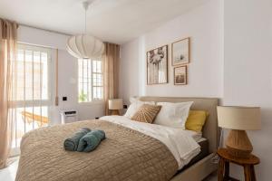 A bed or beds in a room at Eco Playa Suites - Beach & Golf!