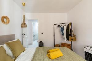A bed or beds in a room at Eco Playa Suites - Beach & Golf!
