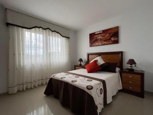 Postel nebo postele na pokoji v ubytování Apartamentos María de Lucía - Piso B