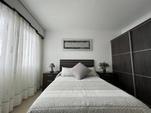 Postel nebo postele na pokoji v ubytování Apartamentos María de Lucía - Piso B