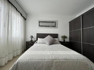 Postel nebo postele na pokoji v ubytování Apartamentos María de Lucía - Piso B
