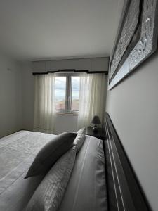 Postel nebo postele na pokoji v ubytování Apartamentos María de Lucía - Piso B