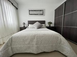 Postel nebo postele na pokoji v ubytování Apartamentos María de Lucía - Piso B