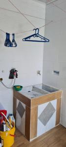 a kitchen with a sink in a room at Casa de descanso con piscina, en venadillo in Venadillo +4 photos