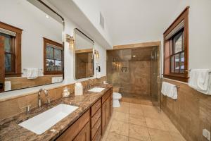 a bathroom with two sinks and a shower at Ballard 203 North - Luxury Condo w/ Postcard Views in Telluride +26 photos