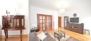 a living room with a couch and a tv at Sofija Apartment in Kotor