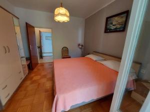 Postel nebo postele na pokoji v ubytování Apartments Fam Tomasic