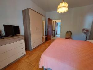 Postel nebo postele na pokoji v ubytování Apartments Fam Tomasic