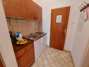 Kuchyň nebo kuchyňský kout v ubytování Apartments Fam Tomasic
