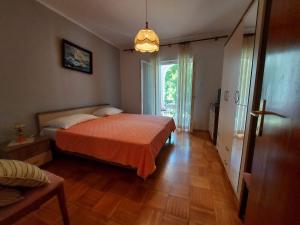 Postel nebo postele na pokoji v ubytování Apartments Fam Tomasic
