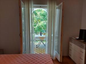 Postel nebo postele na pokoji v ubytování Apartments Fam Tomasic