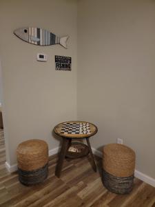 a table and stools in a room with a fish on the wall at Just Breathe in Dandridge