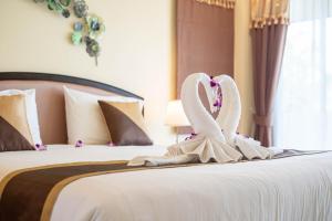 Postel nebo postele na pokoji v ubytování Baan Sailom Hotel Phuket - Sha Extra Plus