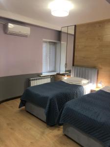 Un pat sau paturi într-o cameră la Samal-2 Hotel