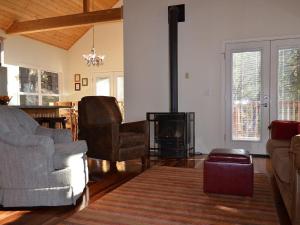 a living room with a couch and a fireplace at Birds Eye Vista in Yosemite West