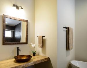 a bathroom with a bowl sink and a mirror at Alpenglow 2 in Yosemite West