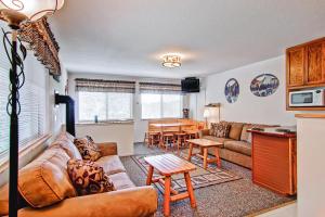 a living room with a couch and a table at Alpine View in Yosemite West