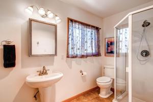 a bathroom with a sink and a toilet and a shower at Fishermen’s Oasis in Oakhurst +13 photos