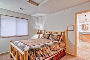 a bedroom with a wooden bed and a window at Explorers Retreat in Yosemite West