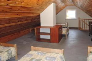 a room with two beds and a wooden ceiling at holiday home, Szczecin in Szczecin